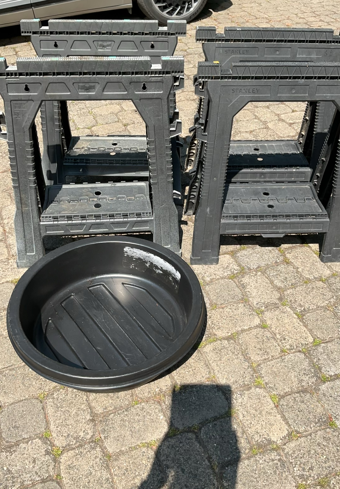 Four Folding Plastic Sawhorses And Large Oil Pan - image 1 of 4