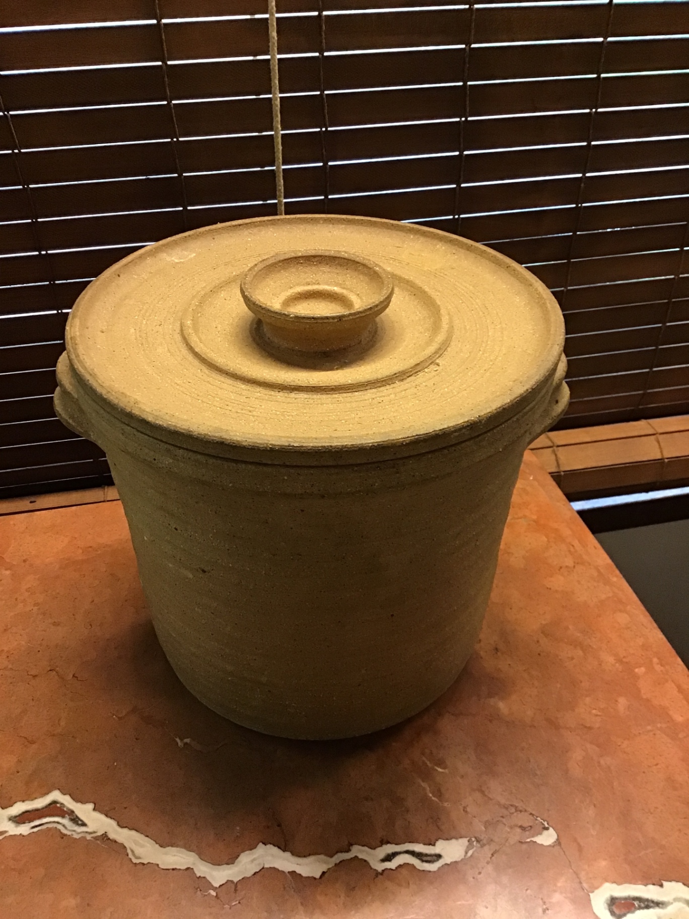 Tan stoneware crock with lid - image 1 of 2