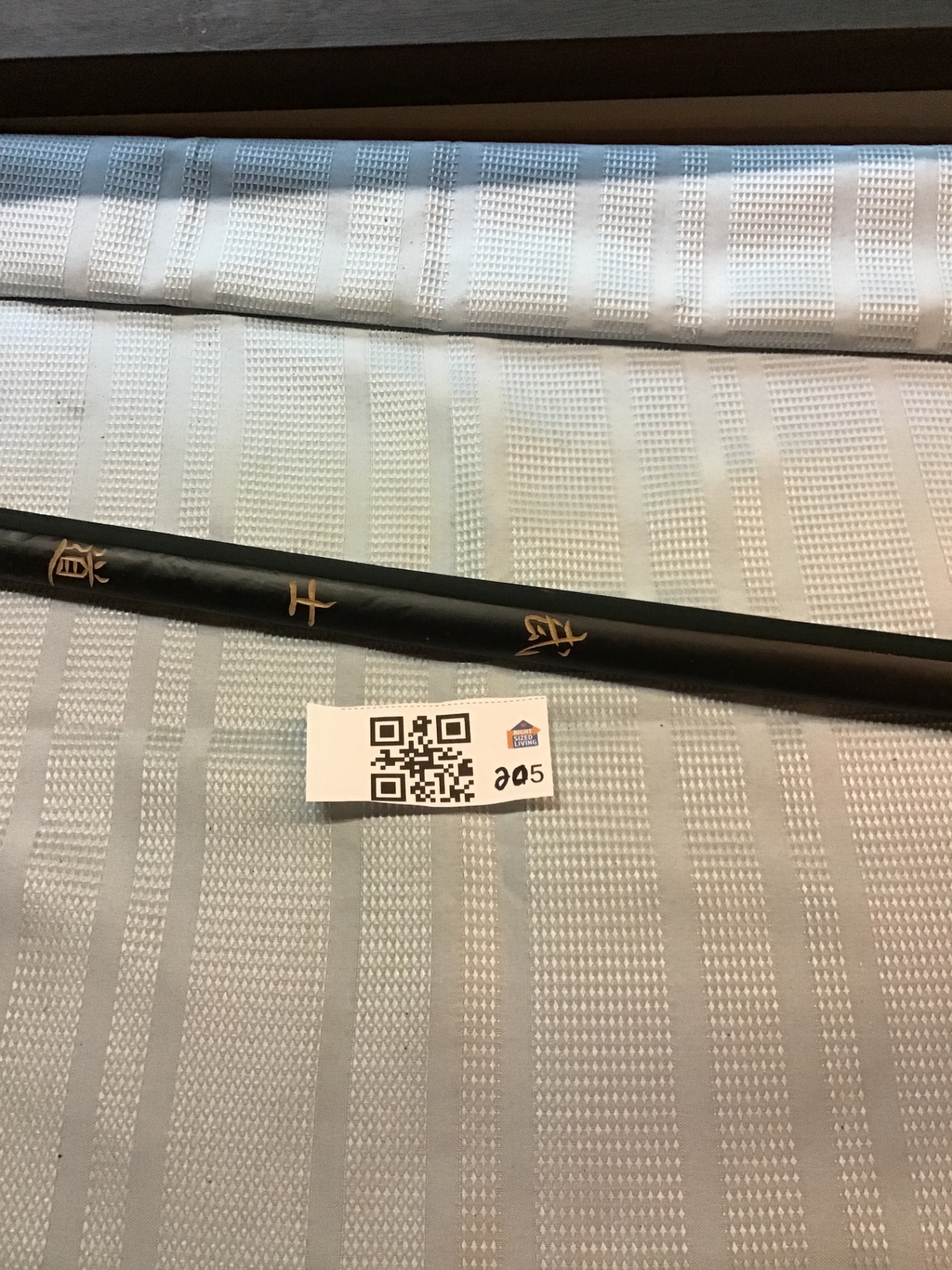 Black Japanese ninja cylindrical rod with gold script  - image 1 of 2