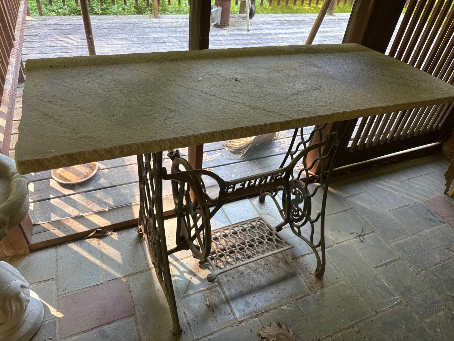 Vintage Singer treadle sewing machine table with stone top - image 1 of 3