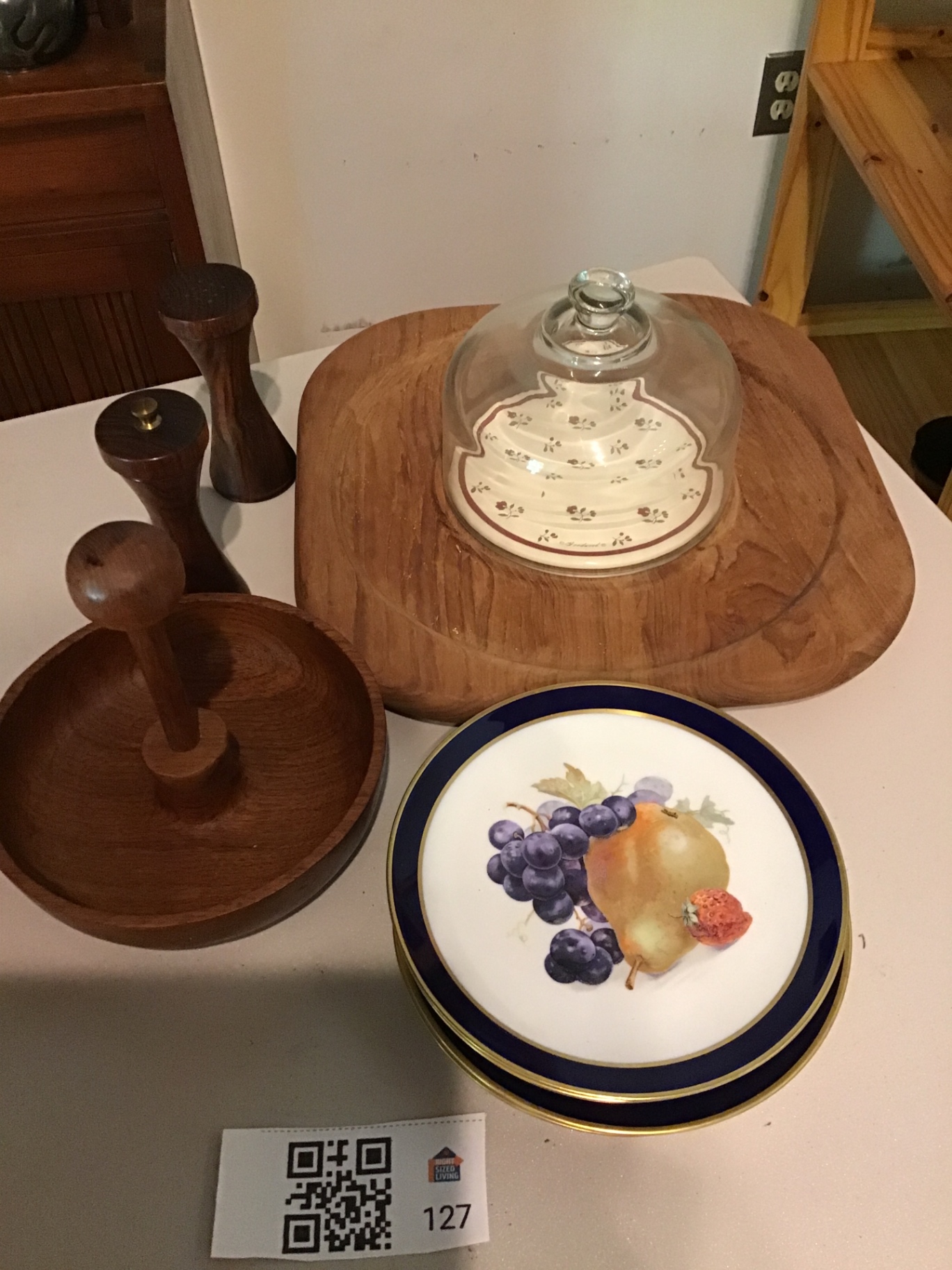 Fruit-patterned cobalt-rim plates with wooden cake stand and pepper mills - image 1 of 3