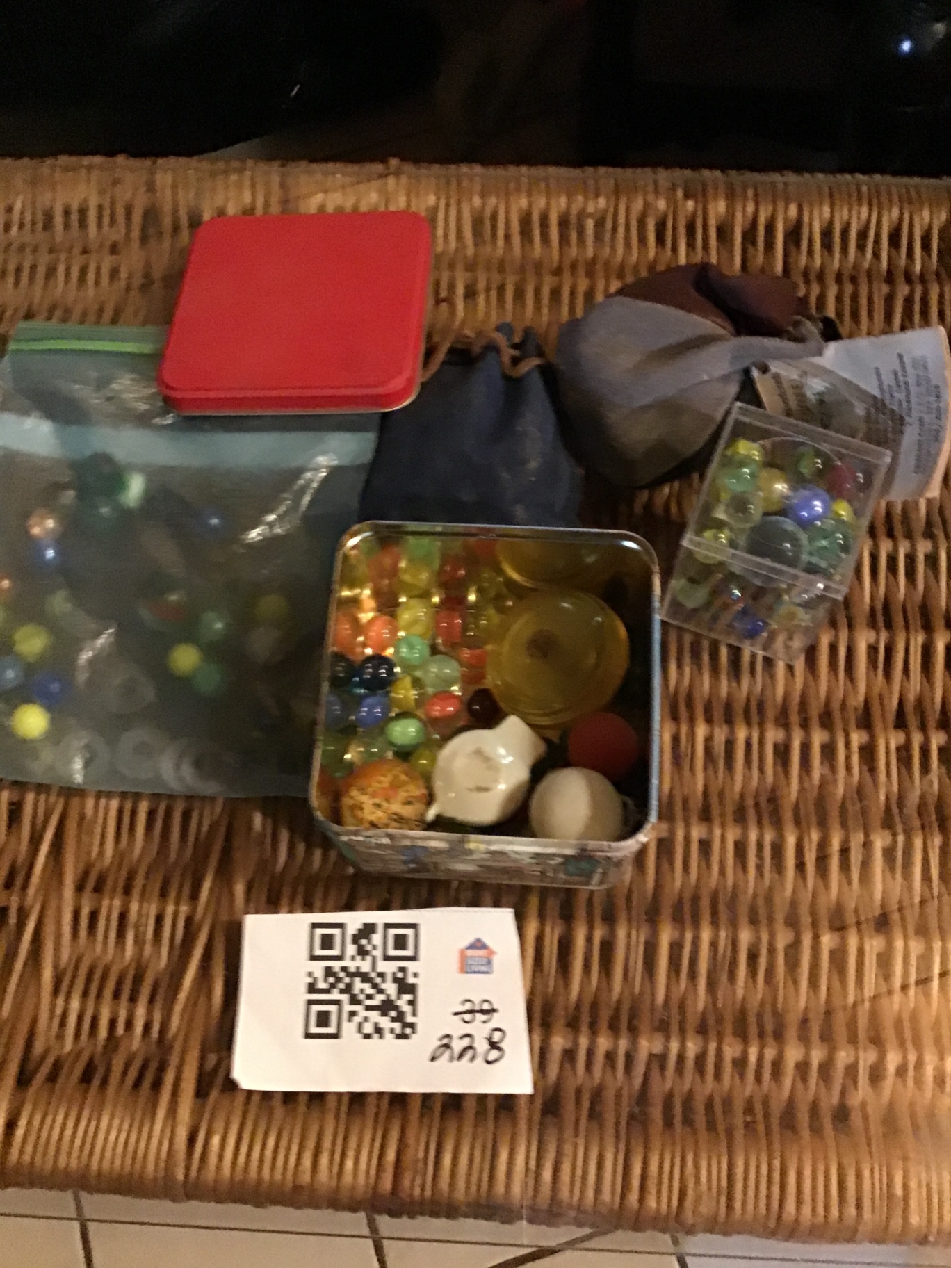 Marbles and marble-game accessories in tins and bags - image 1 of 3
