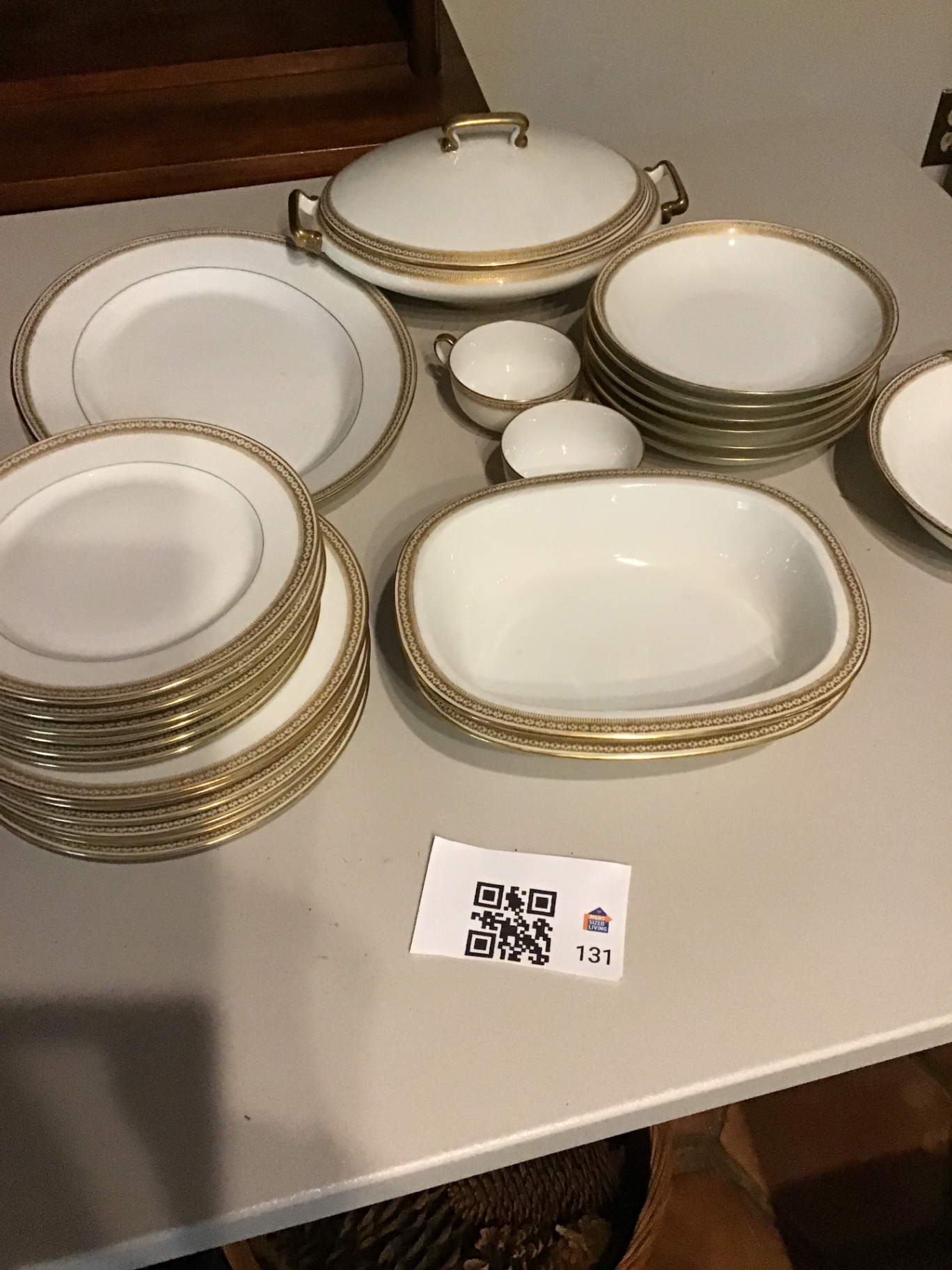 White Limoges porcelain dinnerware set with gold trim and serving pieces - image 1 of 3