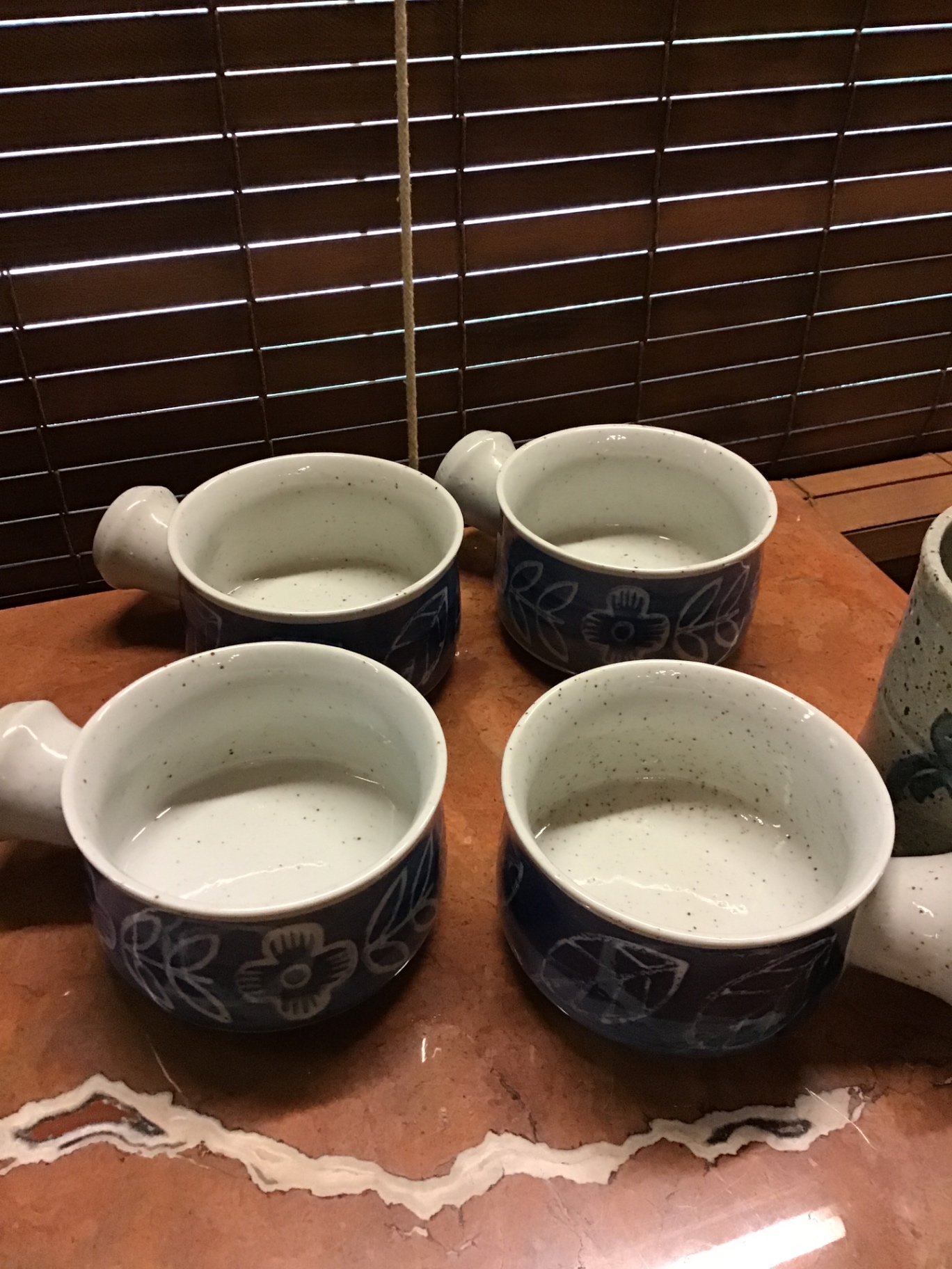 Blue floral ceramic mugs and a speckled gray mug - image 2 of 3