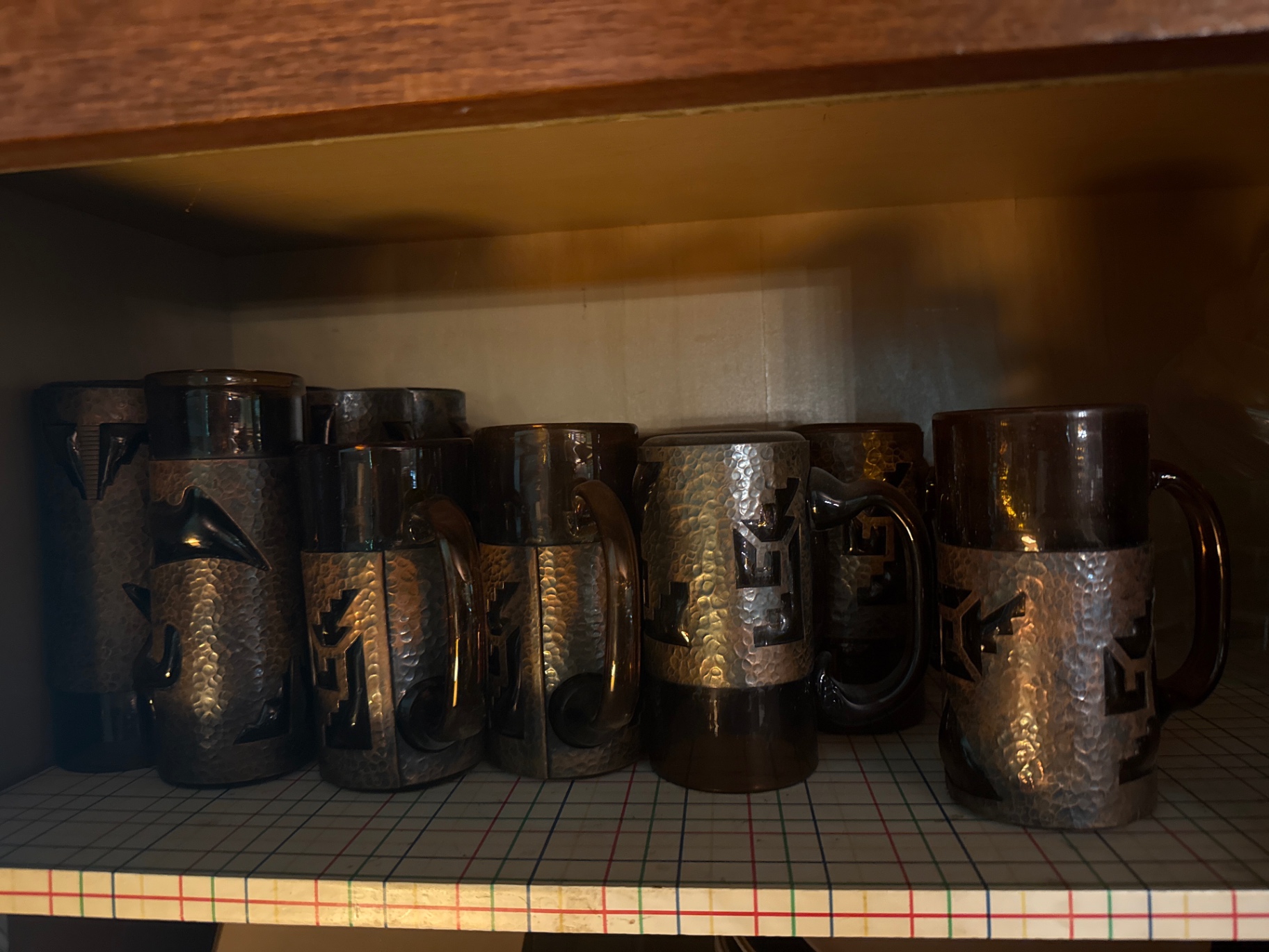 Hammered-metal beer steins with dark tops - image 1 of 4