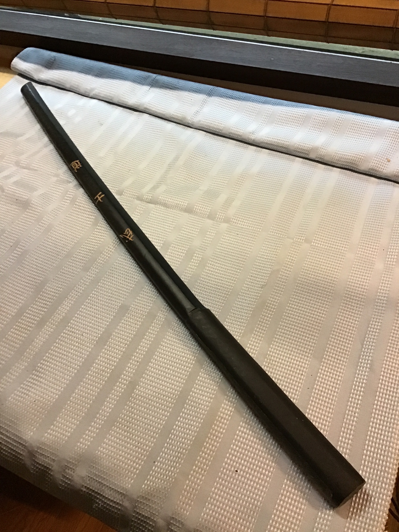 Black Japanese ninja cylindrical rod with gold script  - image 2 of 2