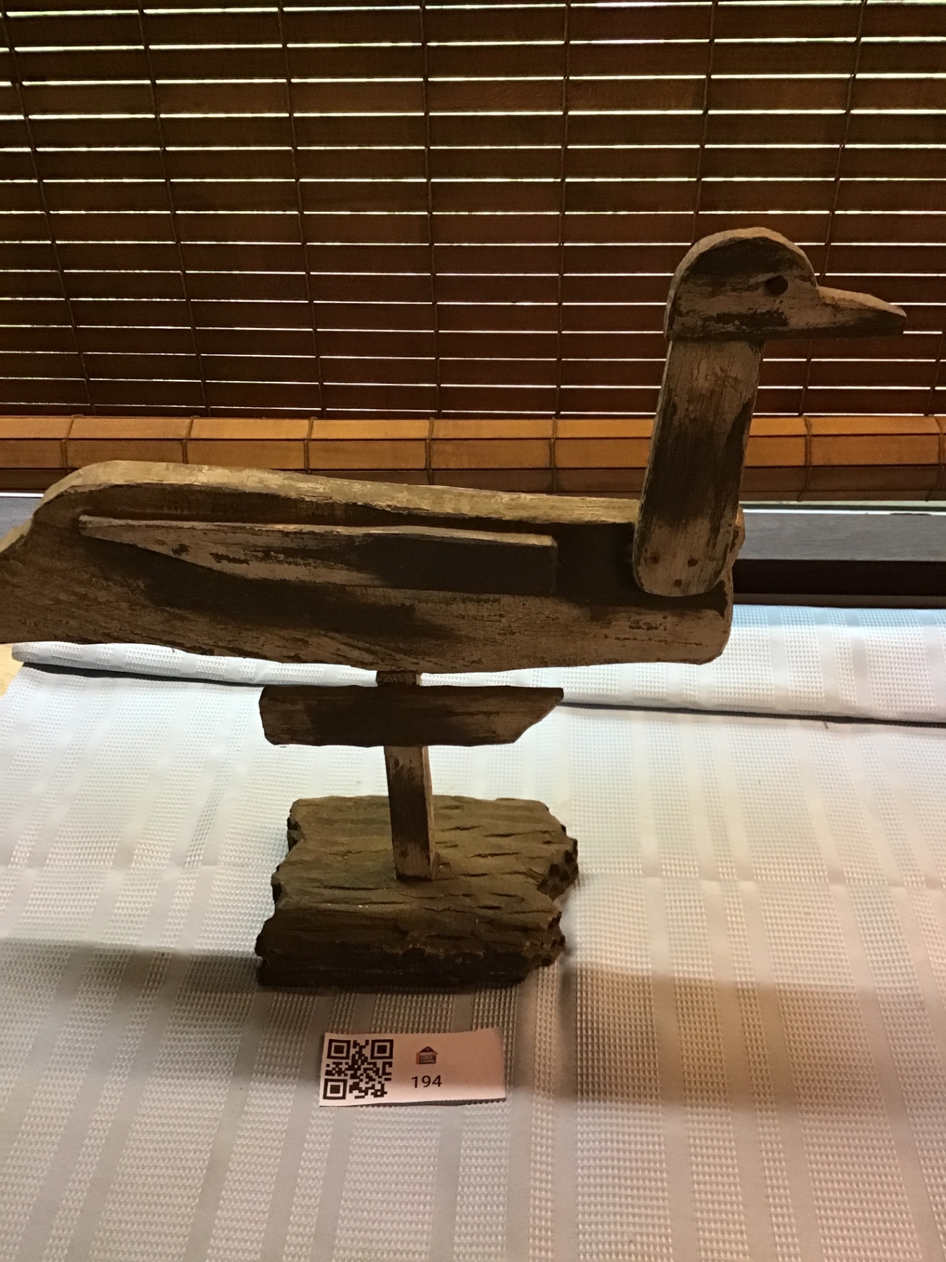 Rustic wooden duck sculpture on a stand - image 1 of 3
