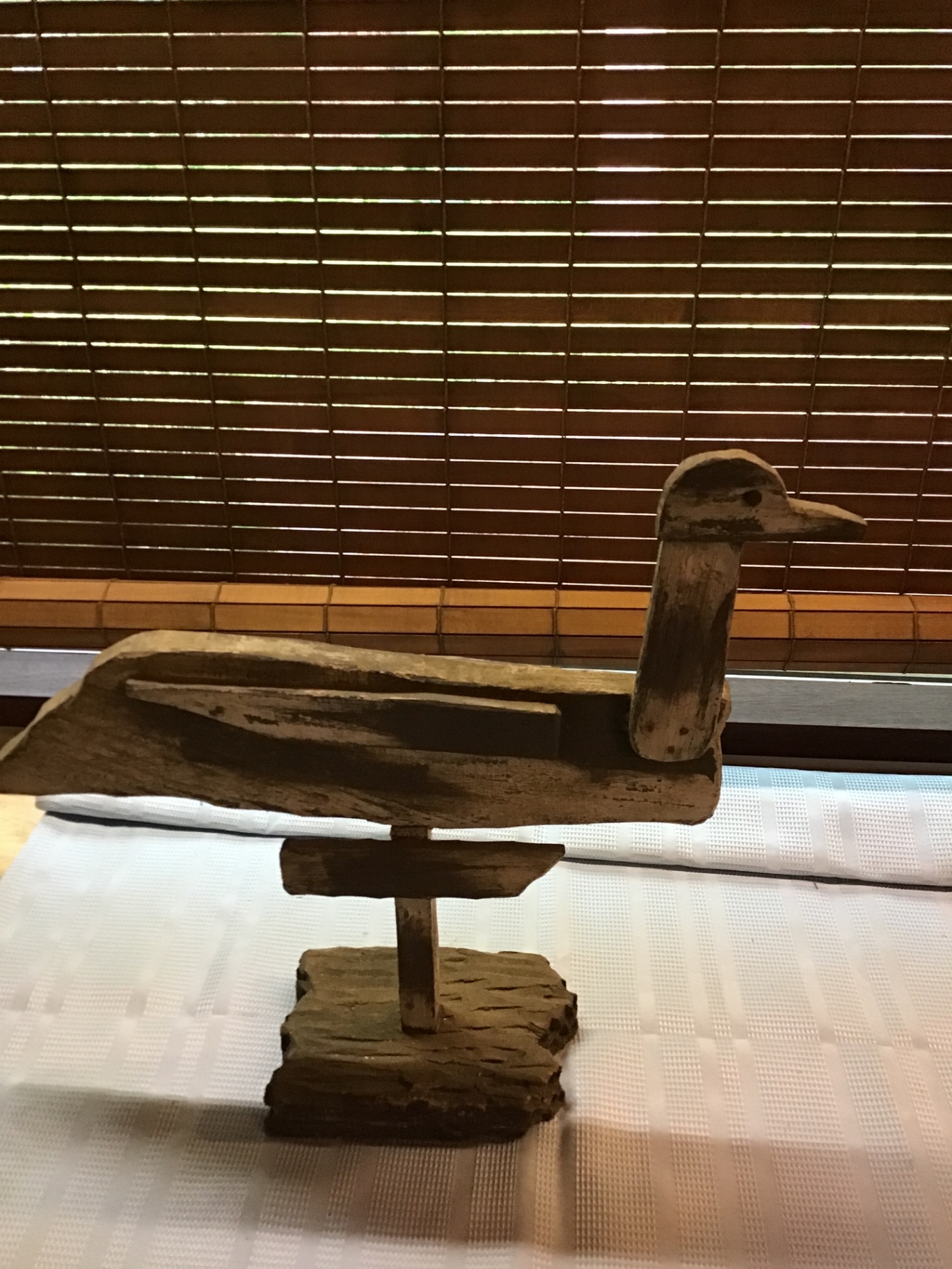 Rustic wooden duck sculpture on a stand - image 2 of 3