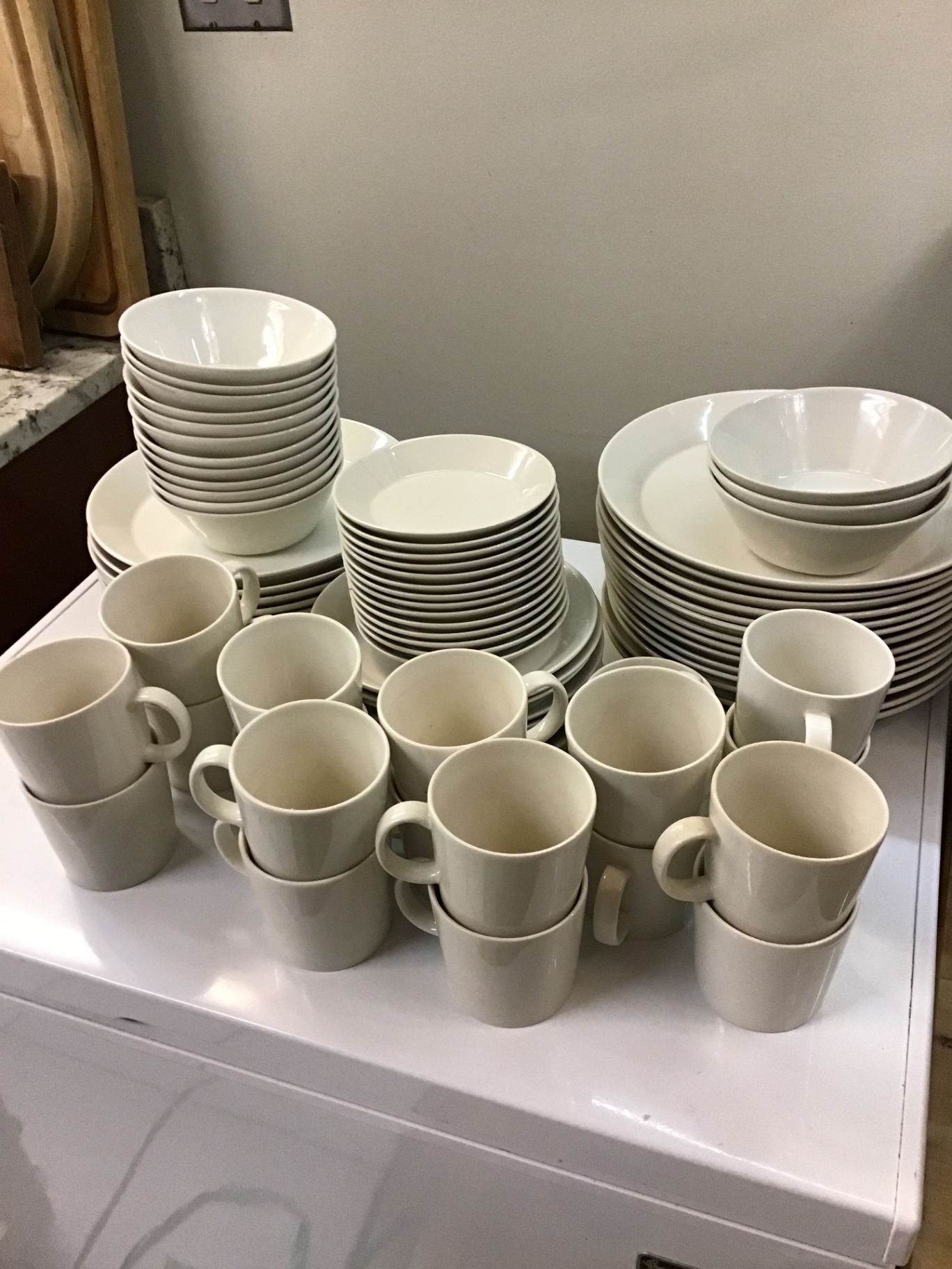 White ceramic dinnerware set (plates, bowls, mugs) - image 1 of 3