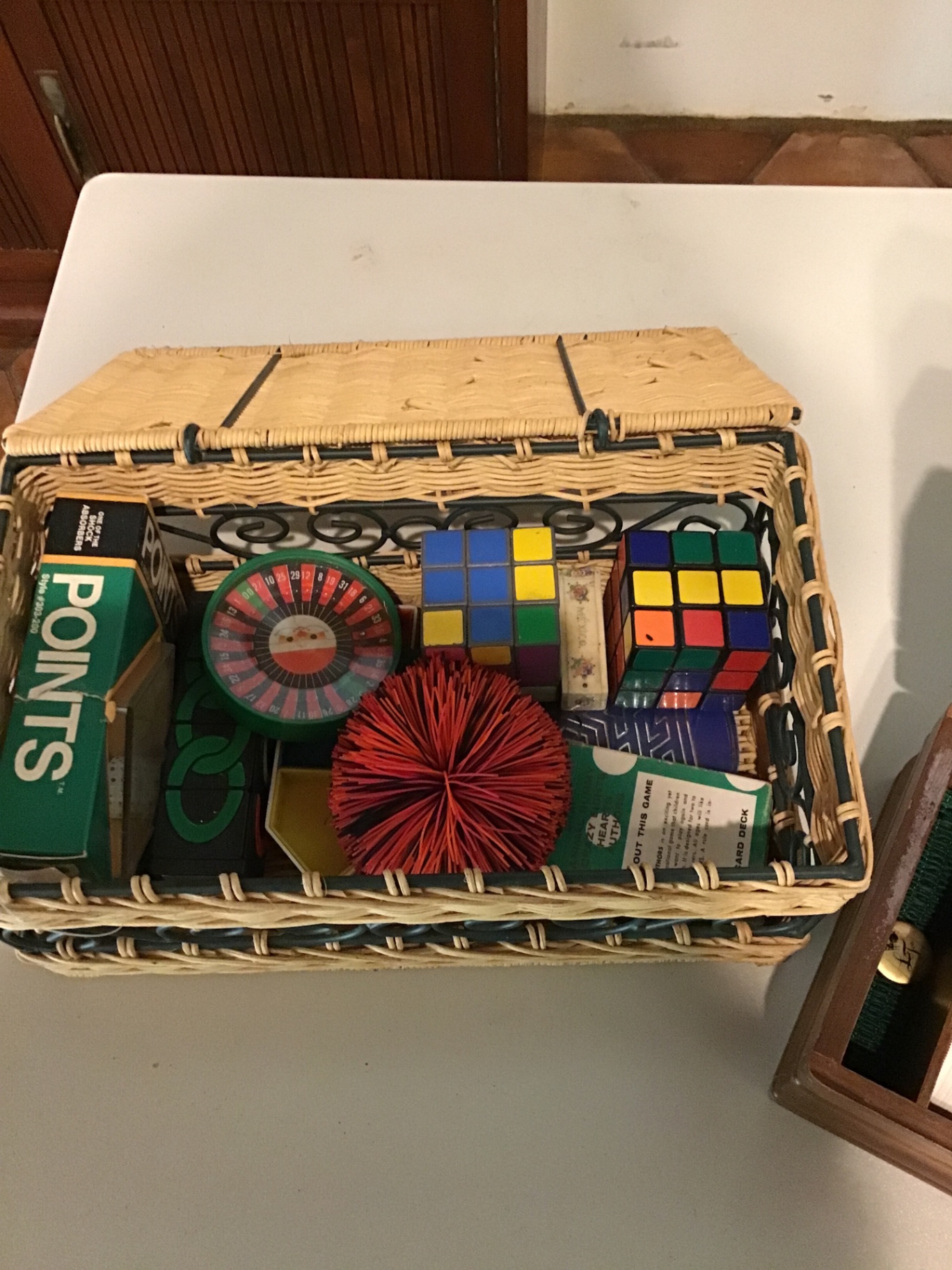 Basket of assorted puzzle games and toys - image 1 of 2
