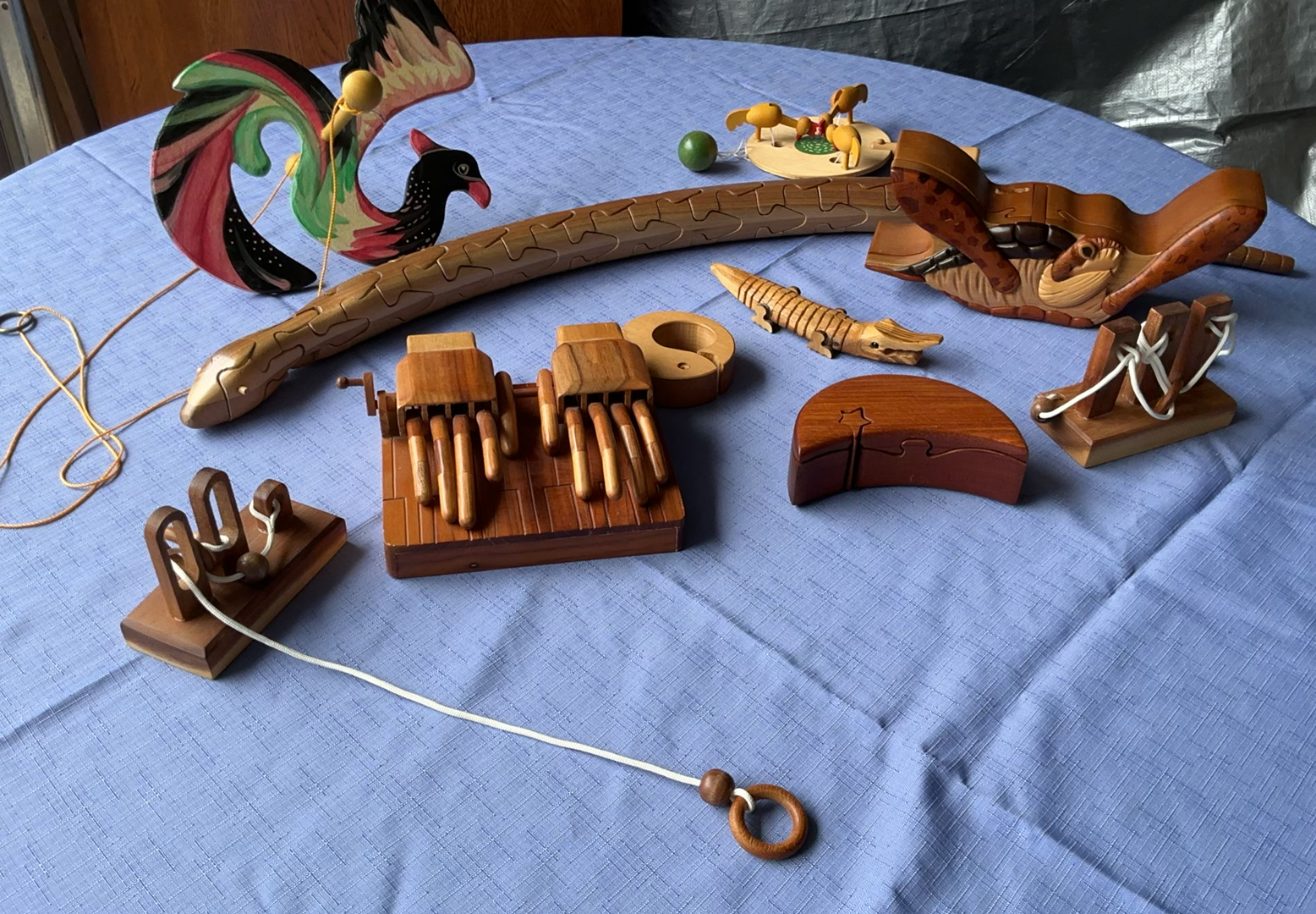 Collection of wooden mechanical toys and puzzles - image 1 of 10