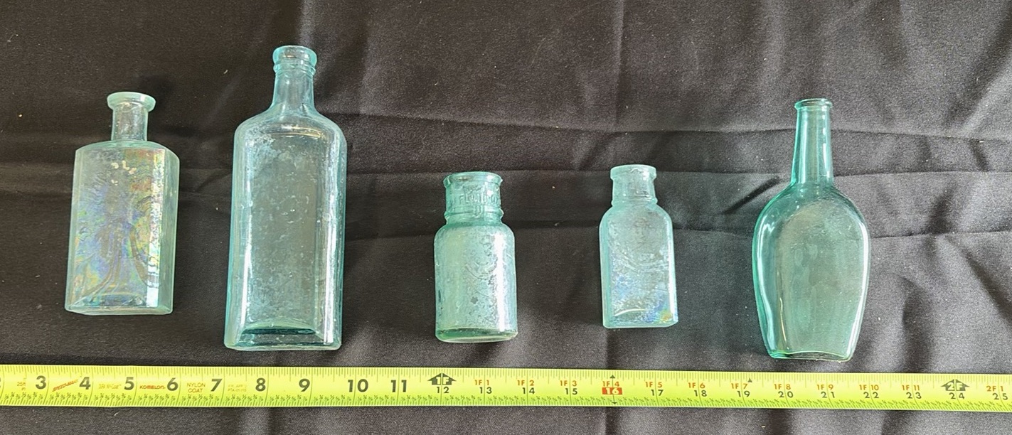 Collection of Five Aqua Glass Bottles - image 1 of 5