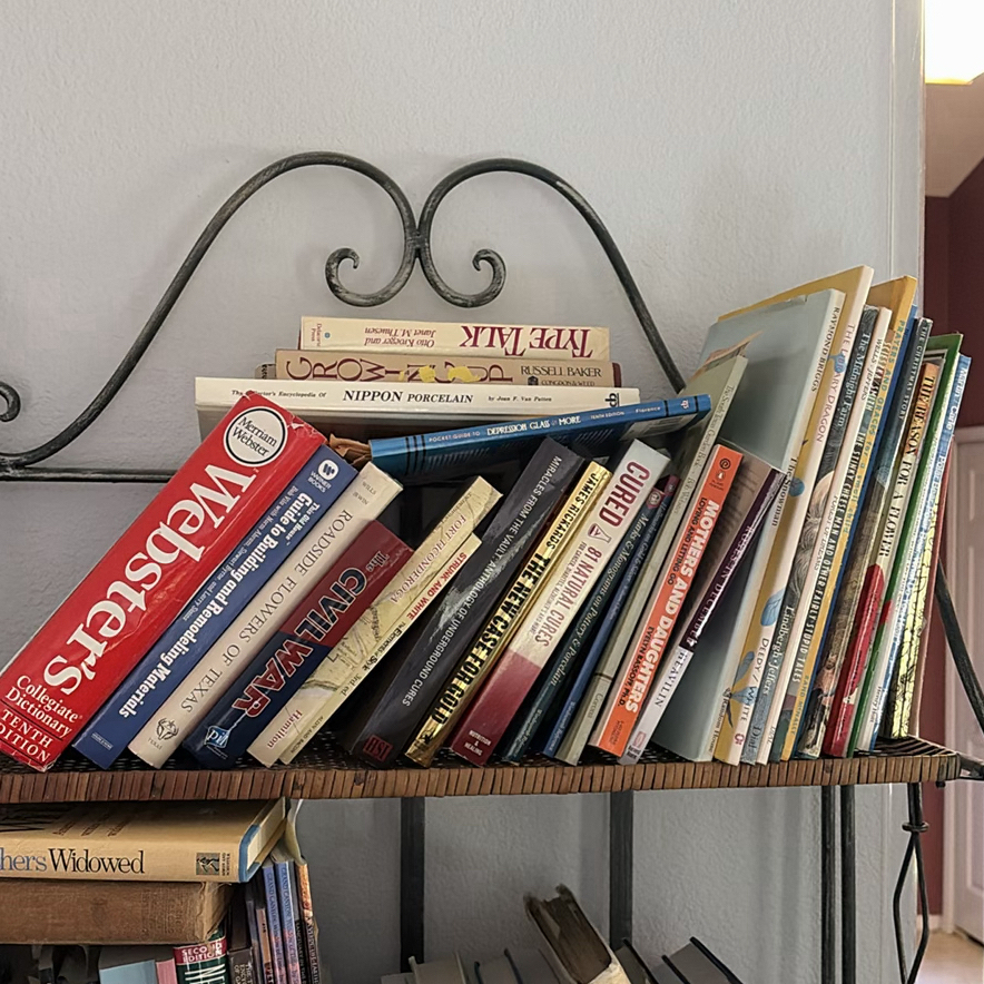 Metal and Wicker Shelving Unit with Books and Decorative Items - image 2 of 19