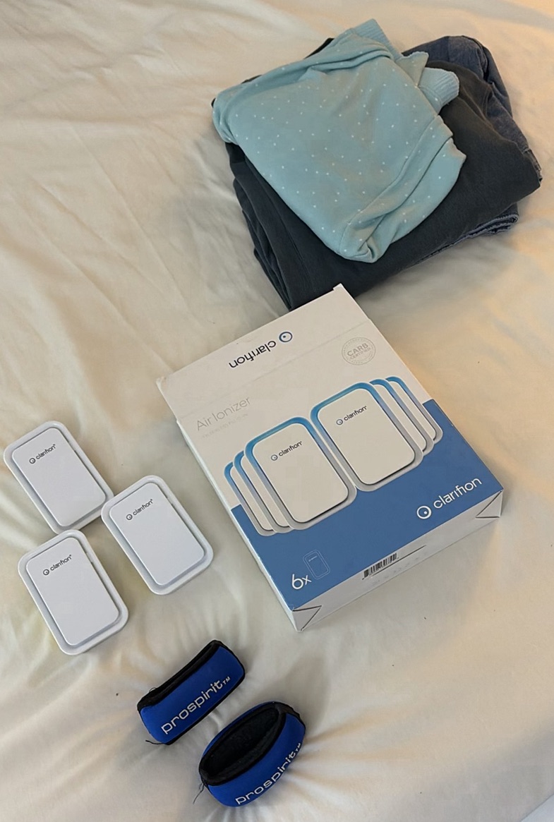 Clarifion Air Ionizers, Prospirit Bands, and Folded Clothing - image 1 of 4