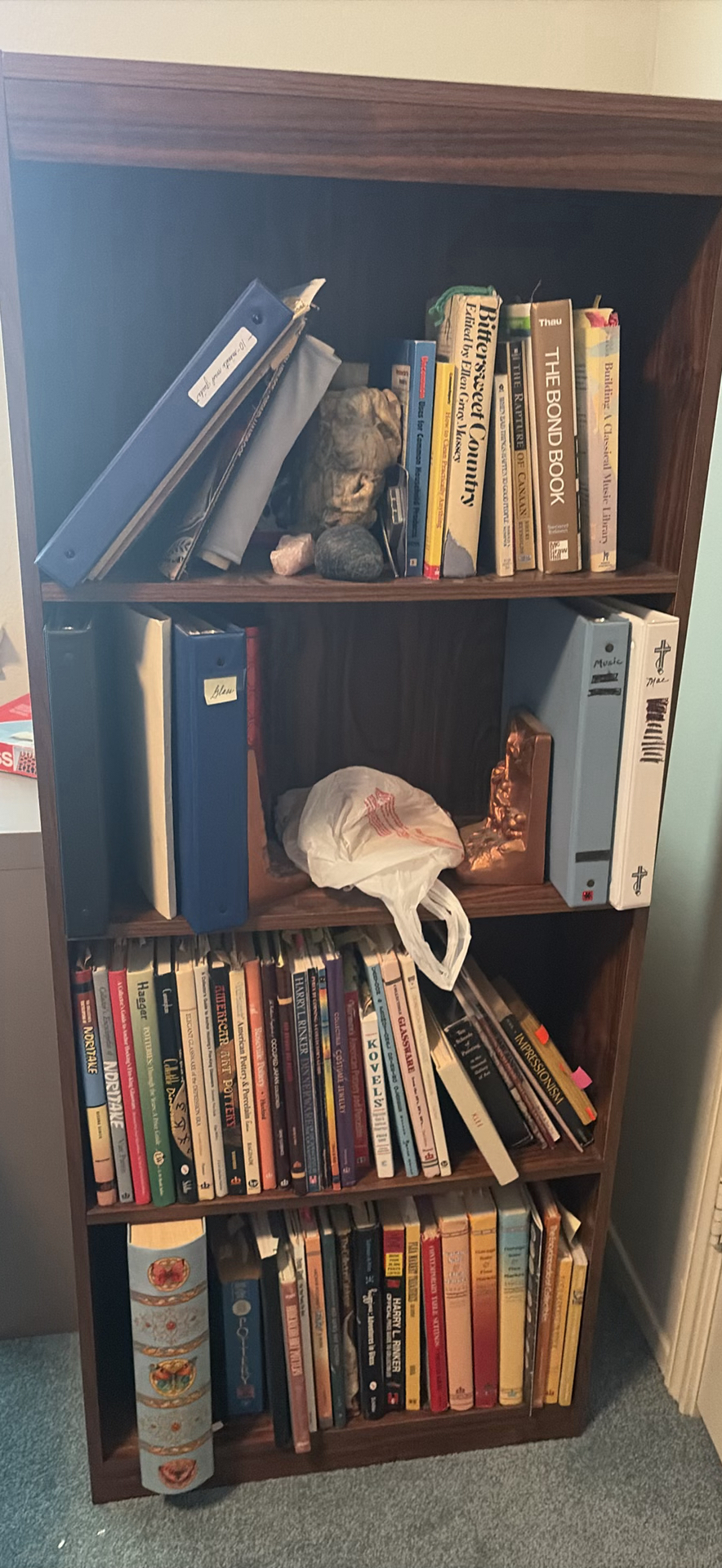 Wooden Bookshelf with Books, Binders, and Decorative Items - image 1 of 12