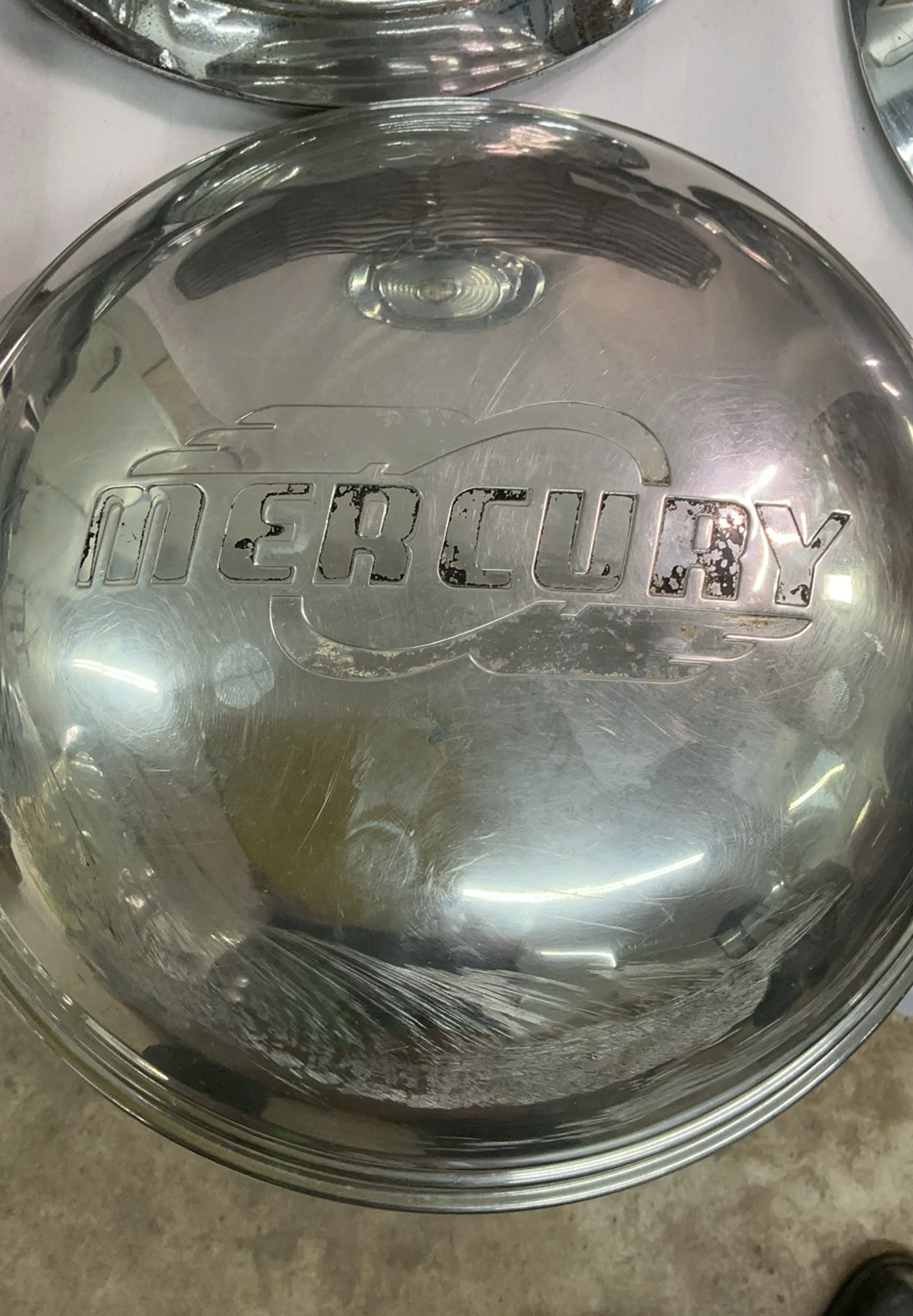 Vintage chrome car hubcaps and grille pieces - image 3 of 8