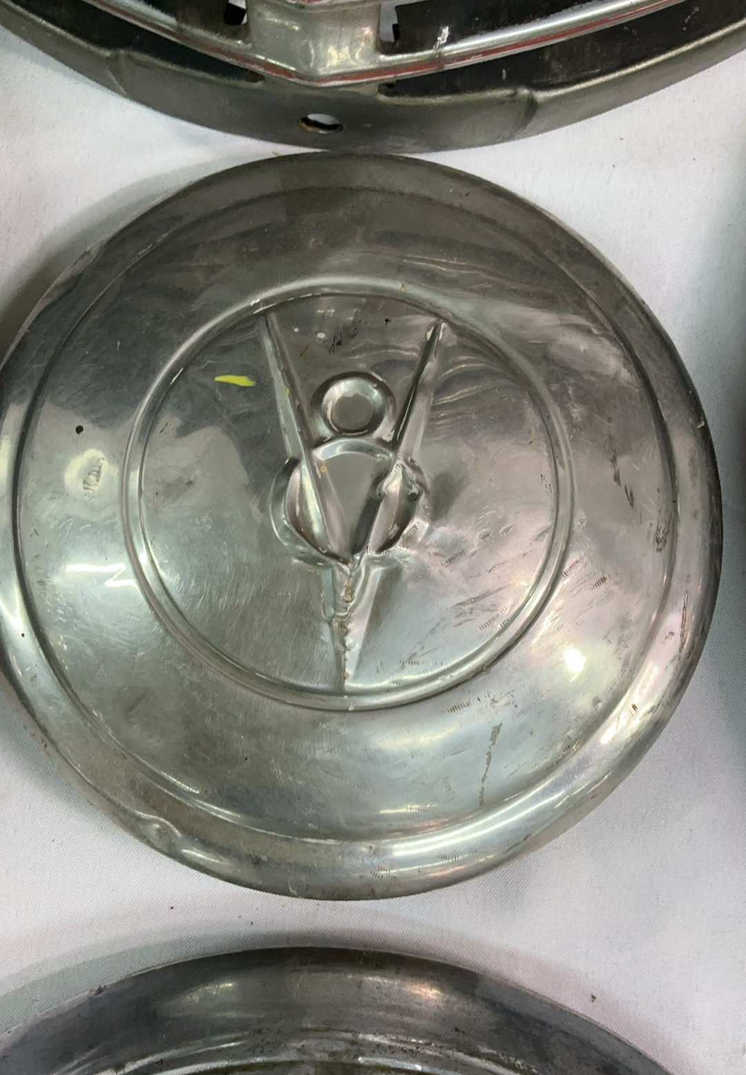 Vintage chrome car hubcaps and grille pieces - image 6 of 8
