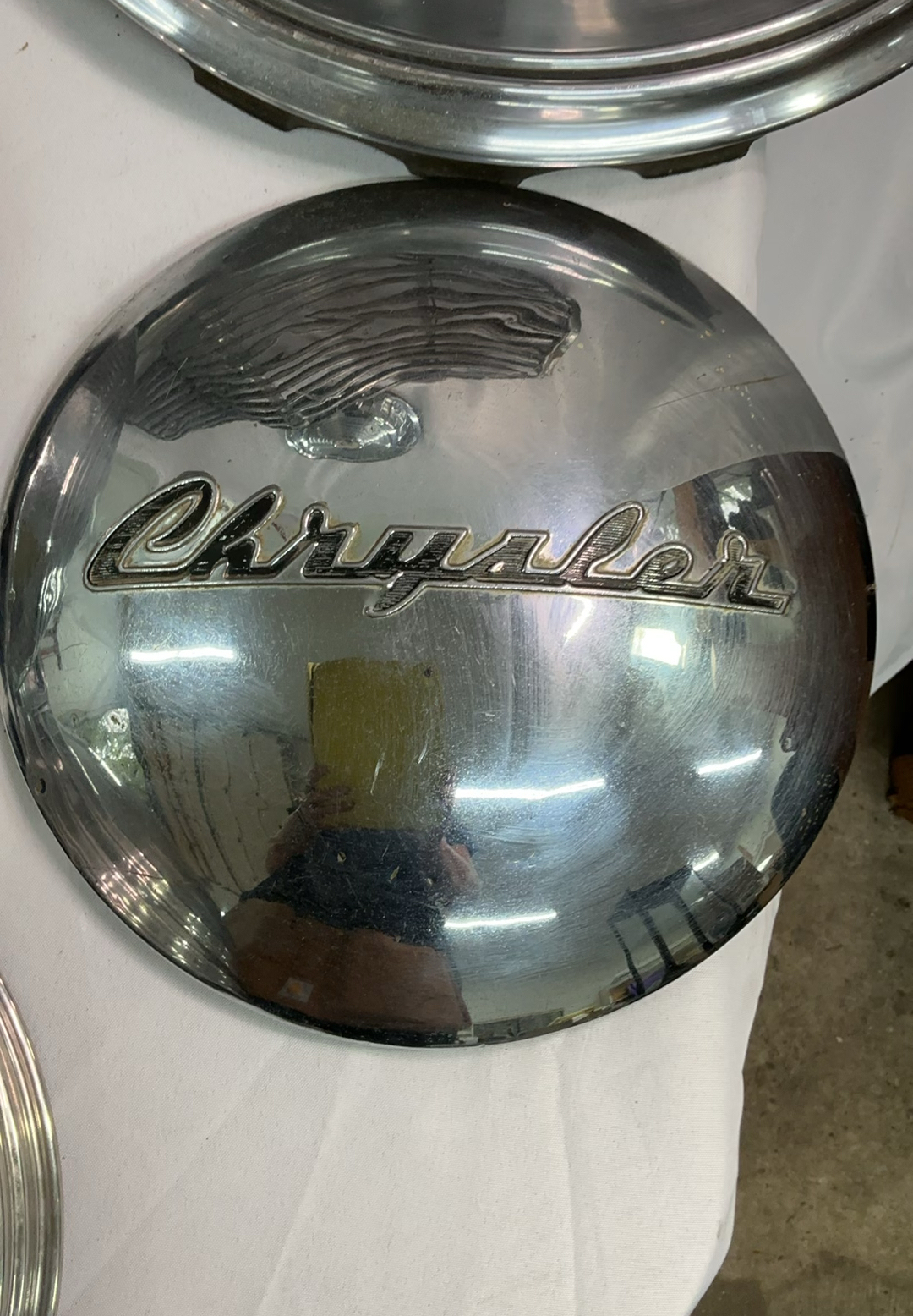 Vintage chrome car hubcaps and grille pieces - image 4 of 8