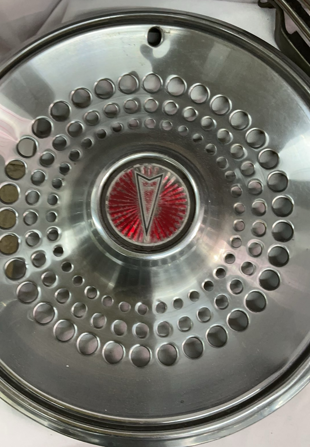 Vintage chrome car hubcaps and grille pieces - image 7 of 8