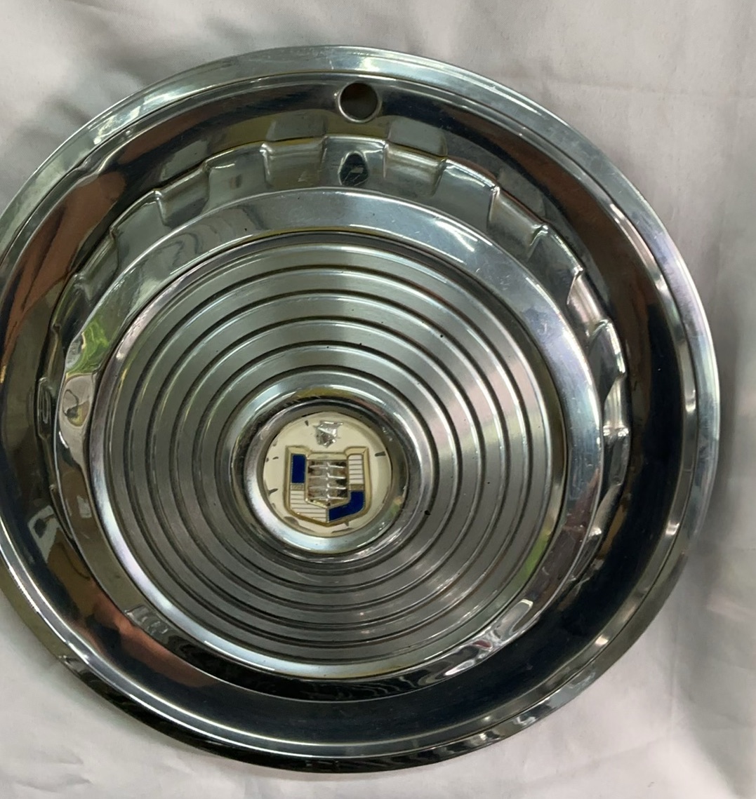 Vintage chrome car hubcaps and grille pieces - image 8 of 8