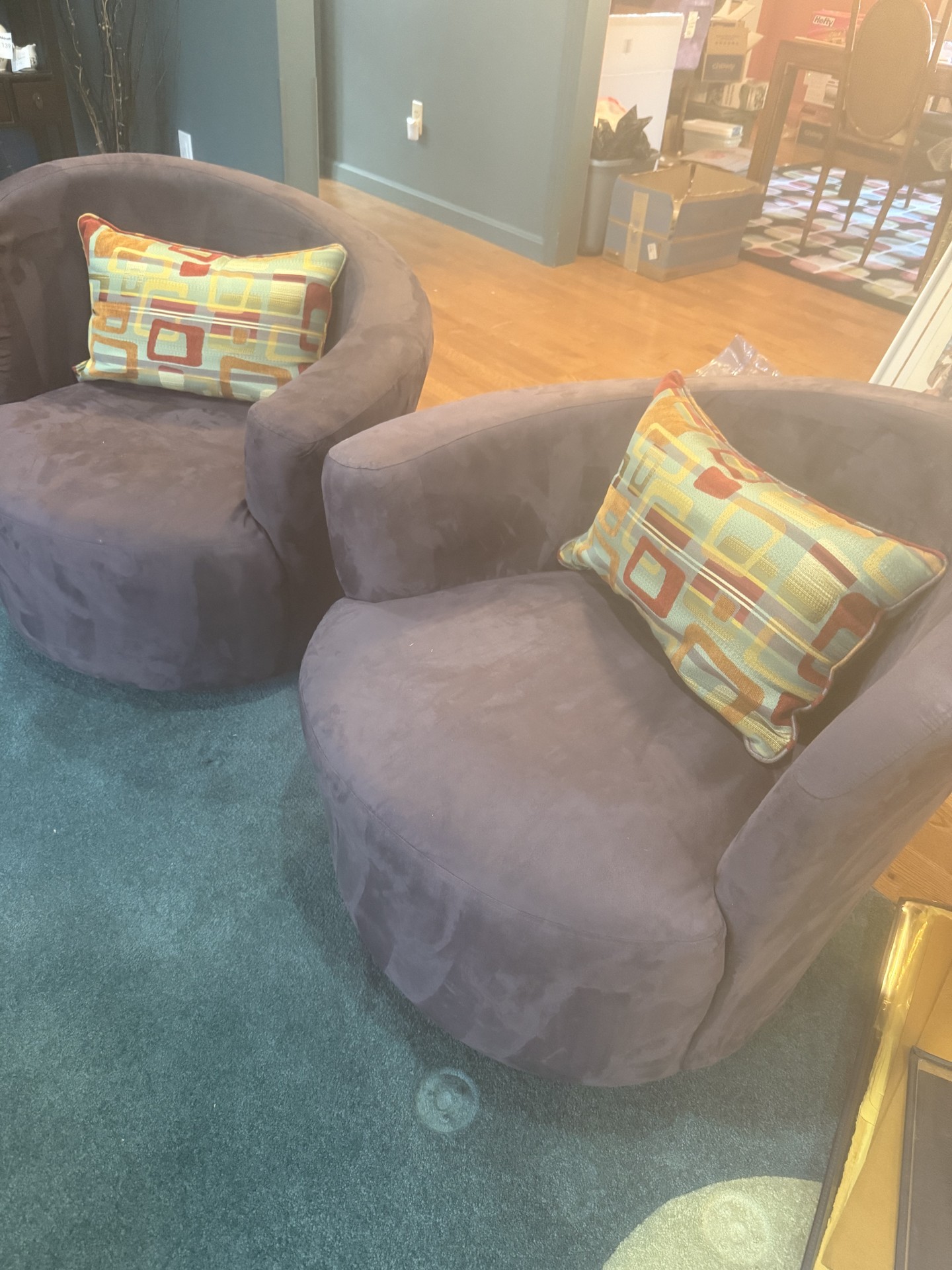 Purple circular lounge chairs with colorful pillows - image 1 of 8