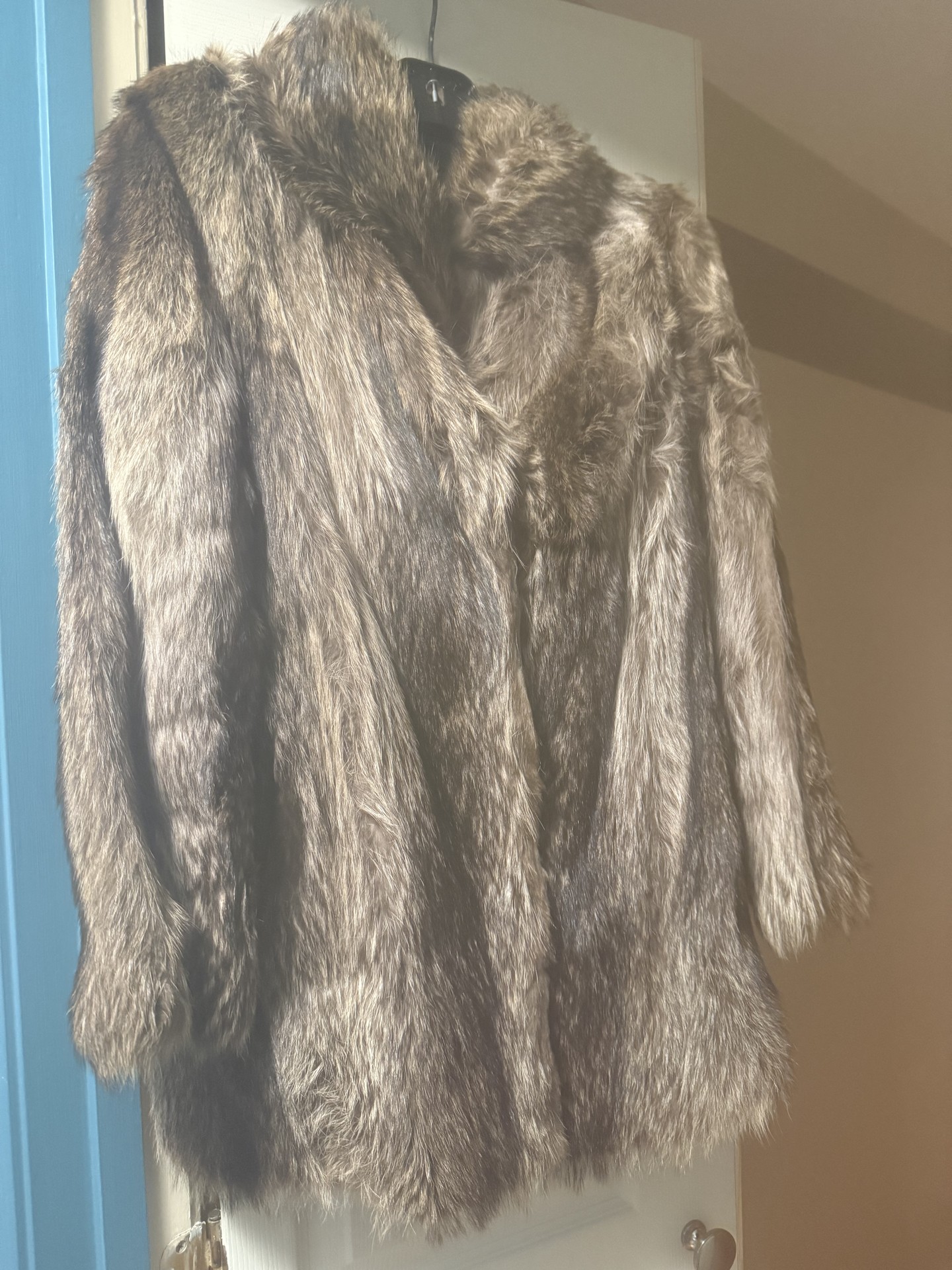 Brown fur coat on hanger - image 1 of 6