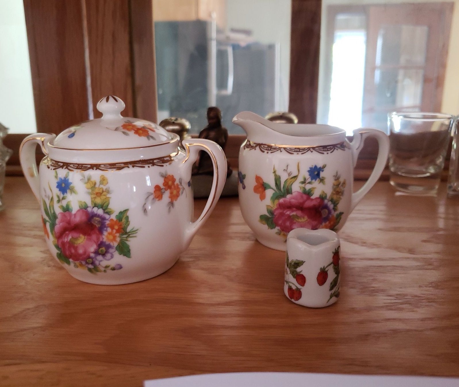 Floral teapot set with creamer and sugar pot, glassware, and figurine - image 3 of 4