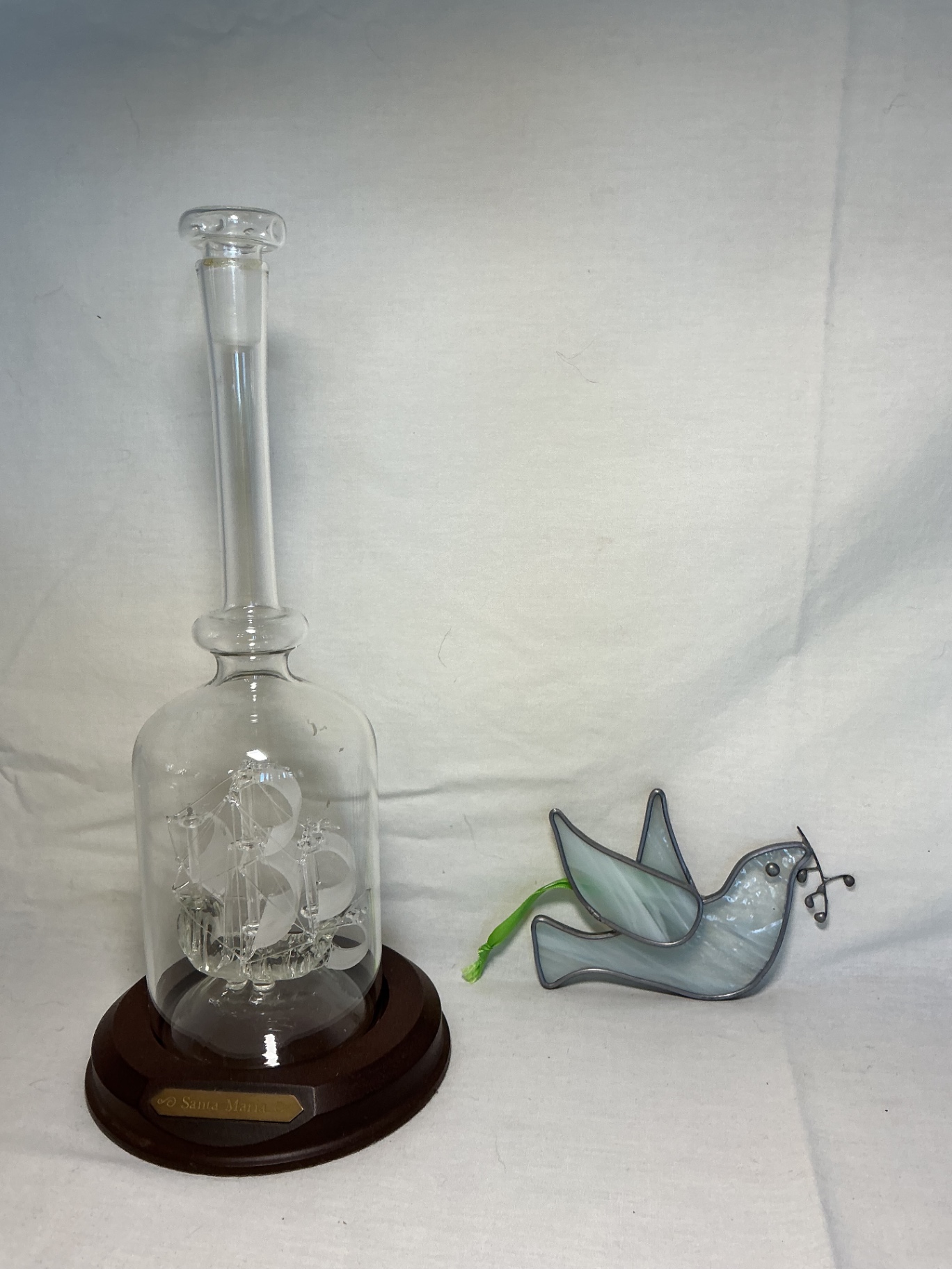 Glass Ship-in-a-bottle glass display with Santa Maria plaque and hanging stained-glass dove. - image 1 of 3