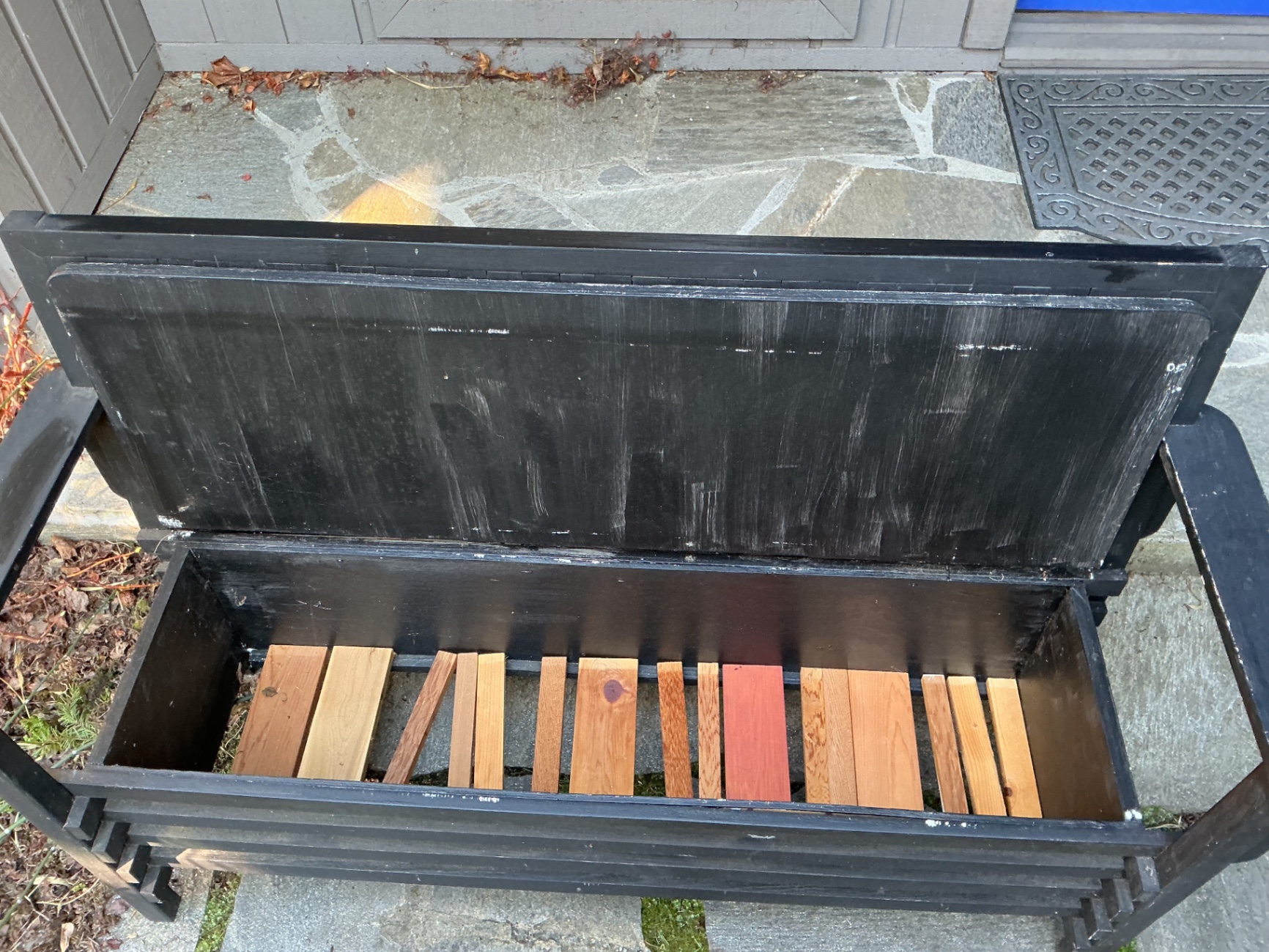 Black outdoor storage bench. - image 2 of 3