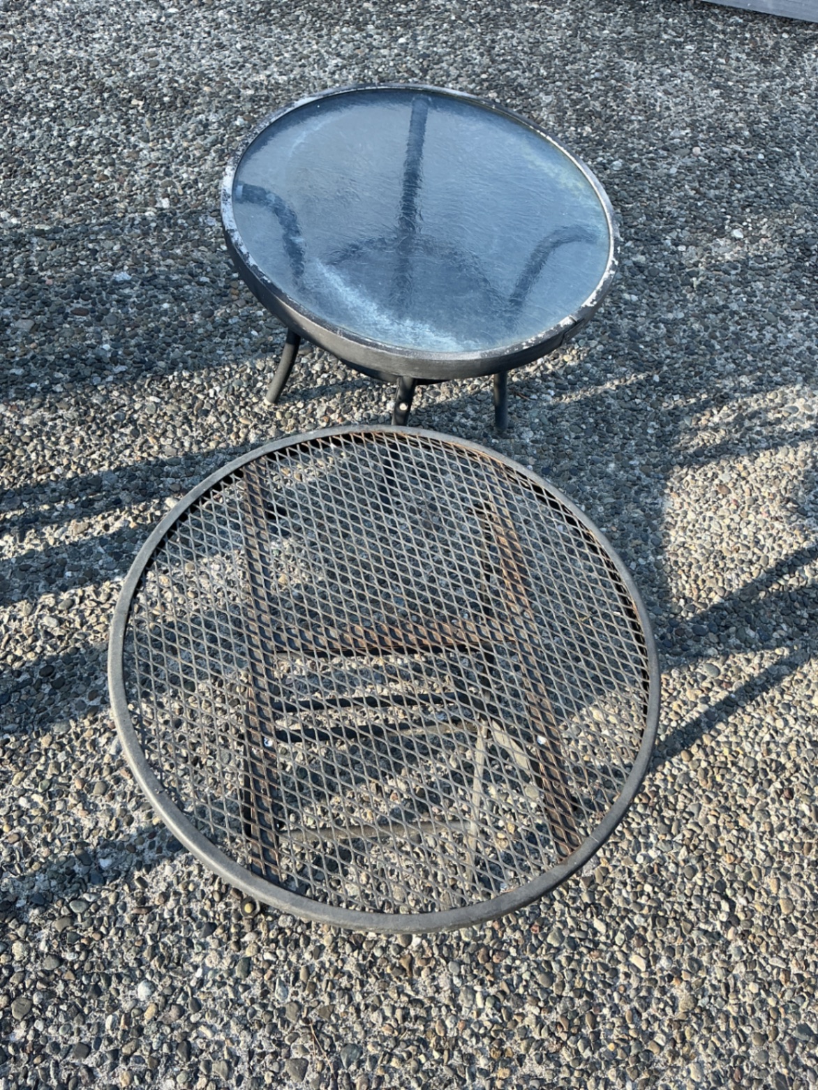 Two gray plastic patio chairs with lattice backs and two round tables (mesh and glass-top) - image 2 of 3