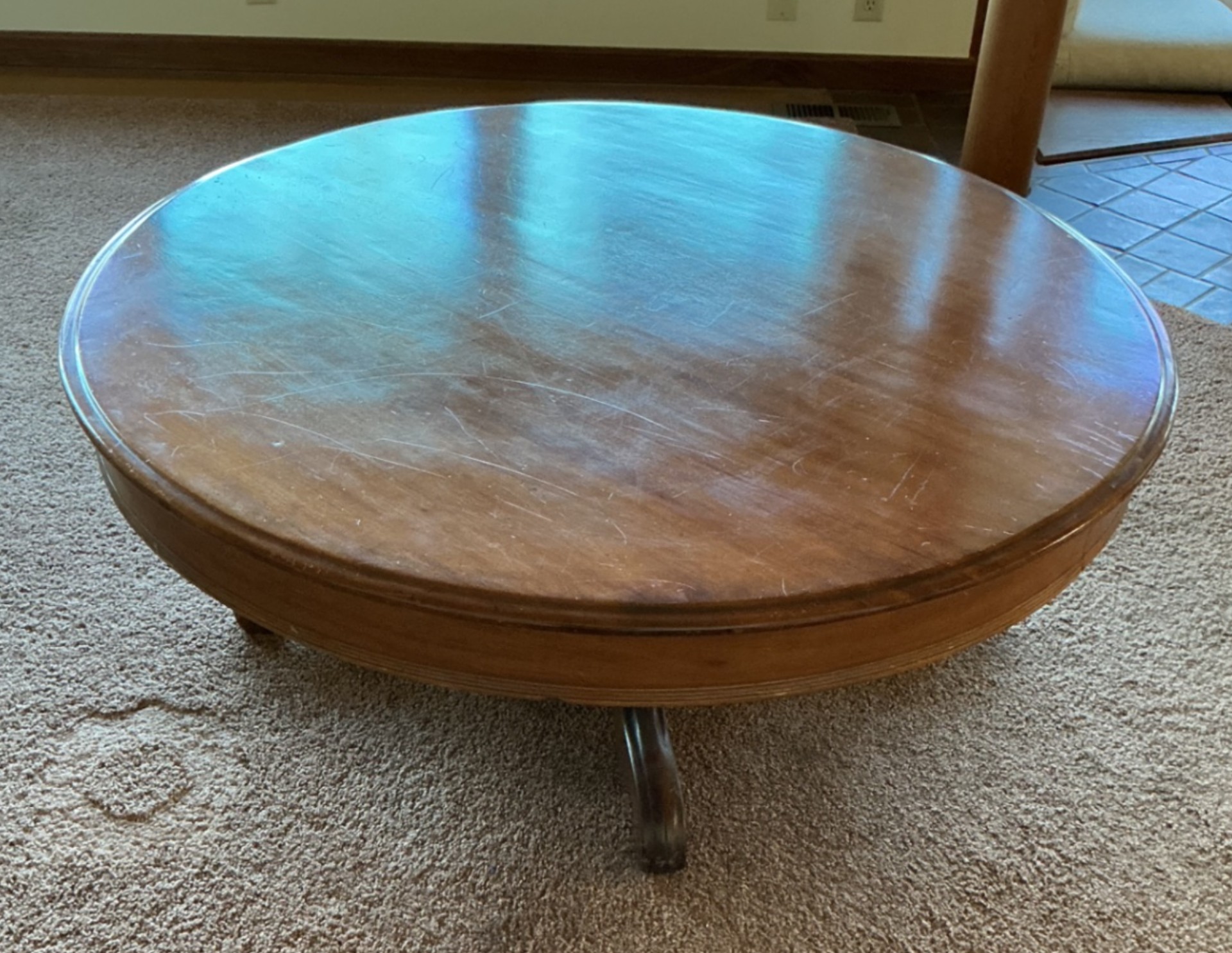 Round wooden coffee table with pedestal base - image 1 of 5