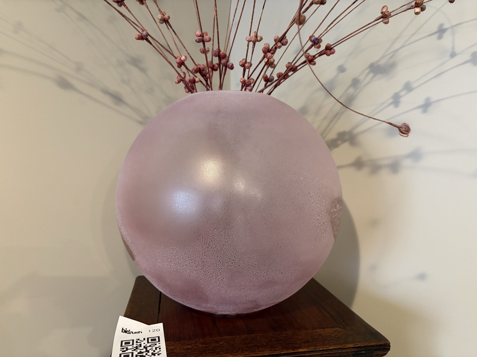 Pink frosted glass sphere vase with twig arrangement - image 1 of 4