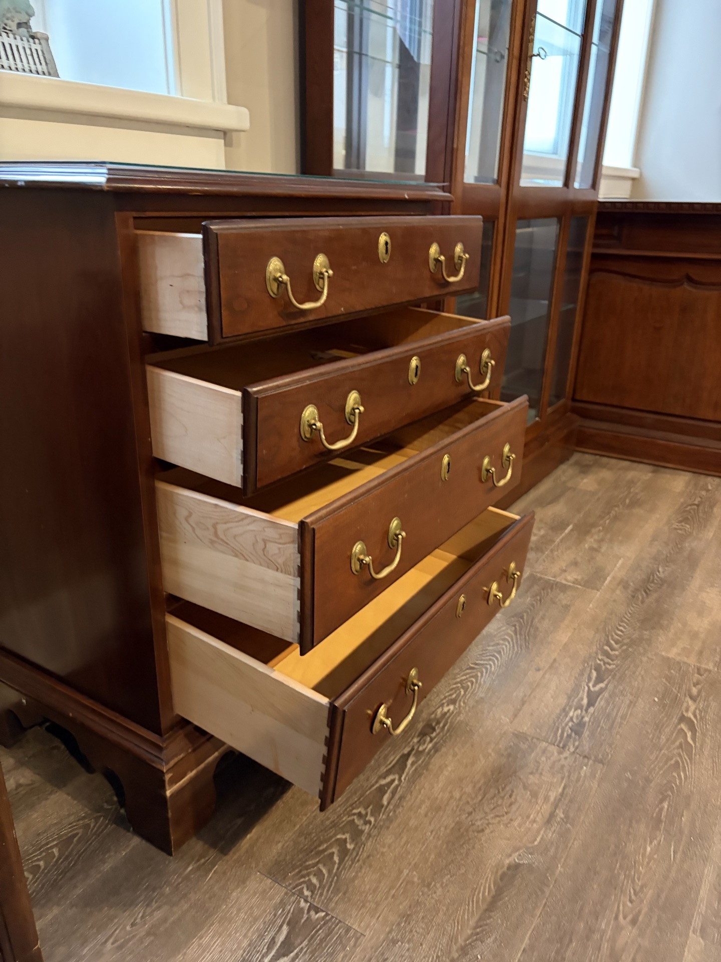 Dark wood five-drawer dresser with brass hardware - image 2 of 7