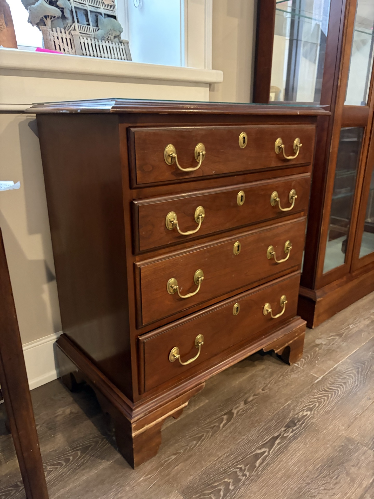 Dark wood five-drawer dresser with brass hardware - image 1 of 7