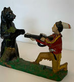 Antique Painted Cast Iron Piggy Bank of Native American hunting a Bear - thumbnail 1 of 7