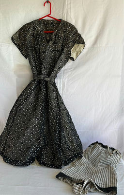 Black floral-print dress with belt and striped romper - Image 1 of 10