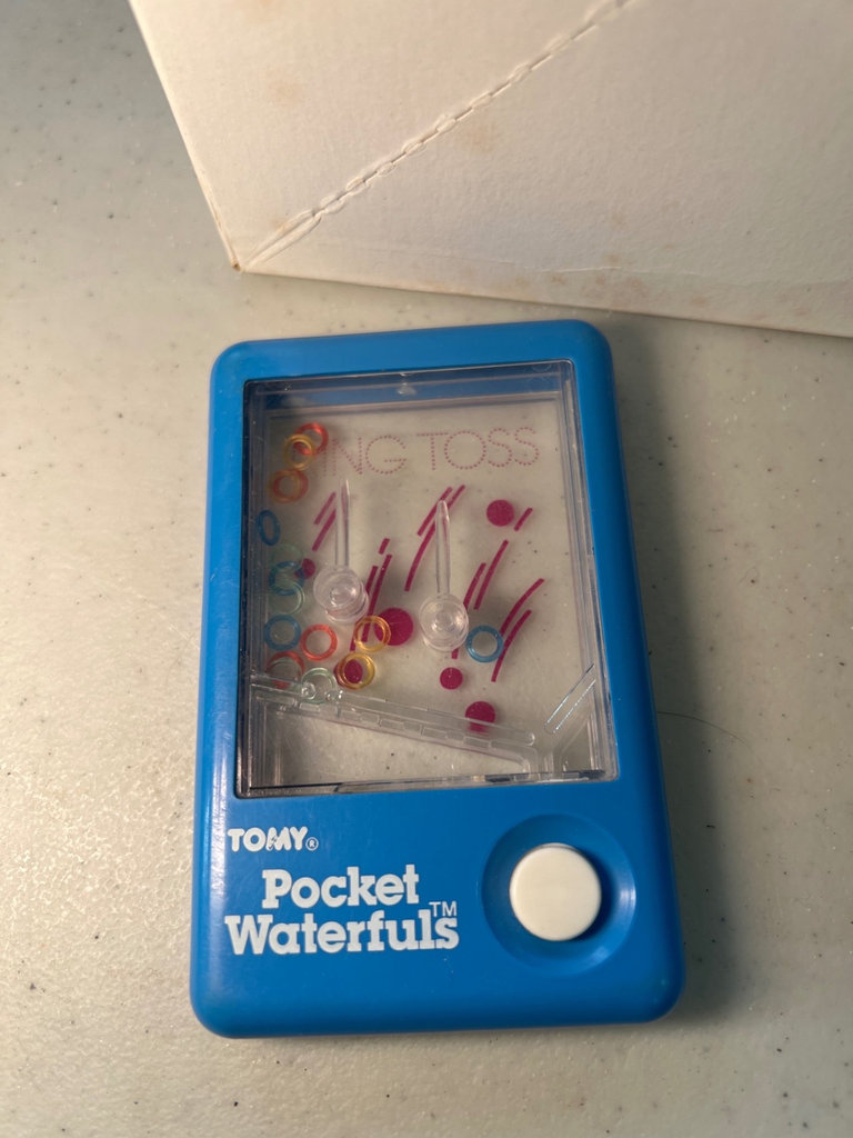 Vintage Clown toy, Puzzler puzzles, Pocket Waterfuls game, and Pig Pad notepad - image 5 of 10