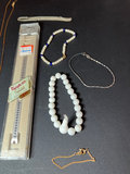 Assorted Jewelry Collection with Beaded Bracelets, Pendants, and Watch Band - thumbnail 2 of 7