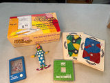 Vintage Clown toy, Puzzler puzzles, Pocket Waterfuls game, and Pig Pad notepad - thumbnail 1 of 10