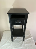 Black end table with drawer and framed abstract artwork, plus blue glass candle holder - thumbnail 4 of 7