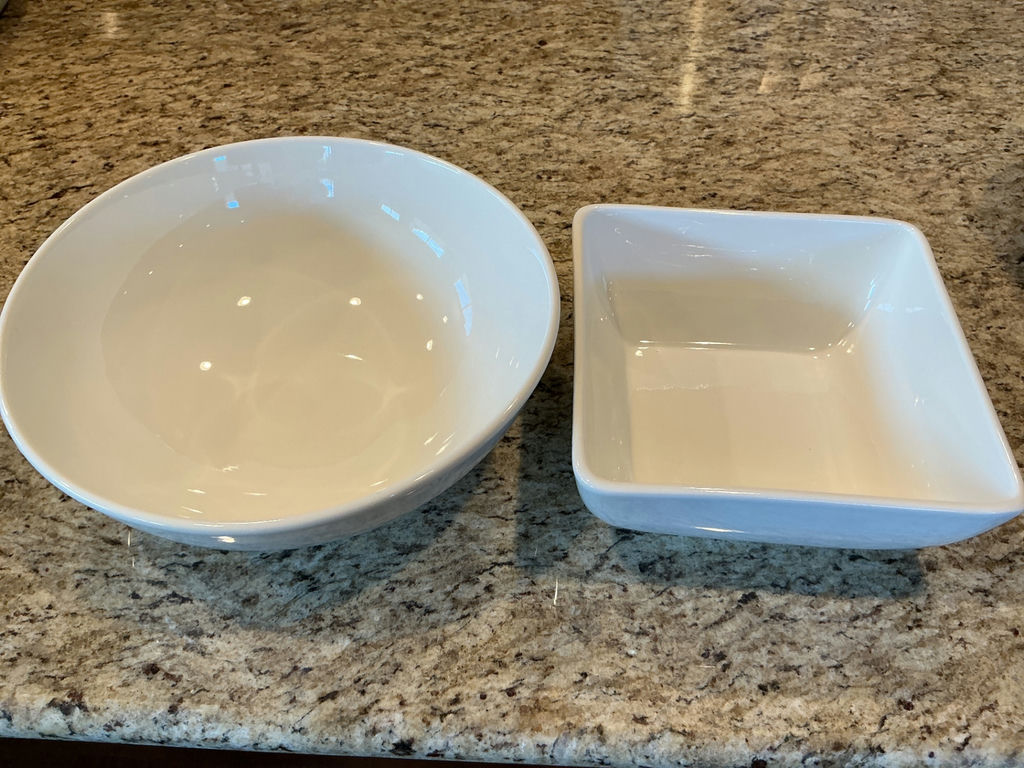 Four white ceramic serving bowls in varying sizes. - image 3 of 4
