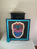 Black end table with drawer and framed abstract artwork, plus blue glass candle holder - thumbnail 1 of 7