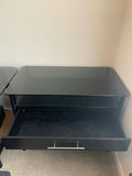 Black two-drawer file cabinet with glass top and  blue glass lamp - thumbnail 3 of 4
