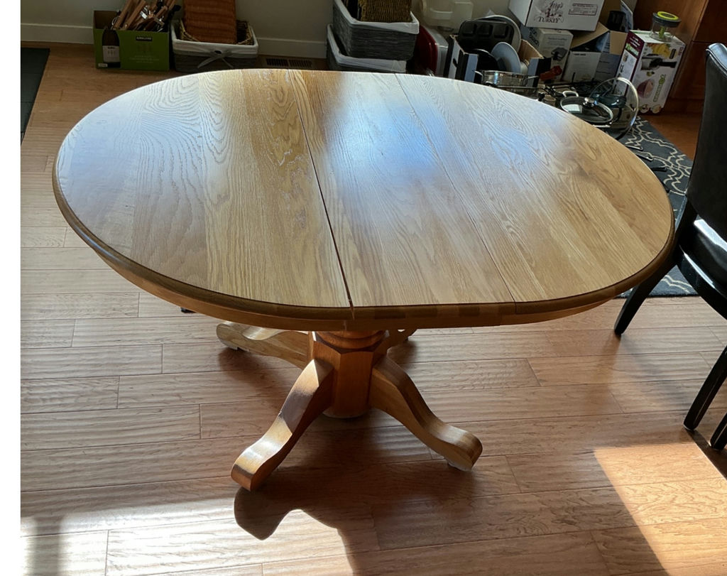 Round wooden dining table with pedestal base and four upholstered chairs - image 2 of 5