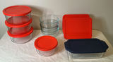 Pyrex glass storage containers with red and blue lids - thumbnail 1 of 4