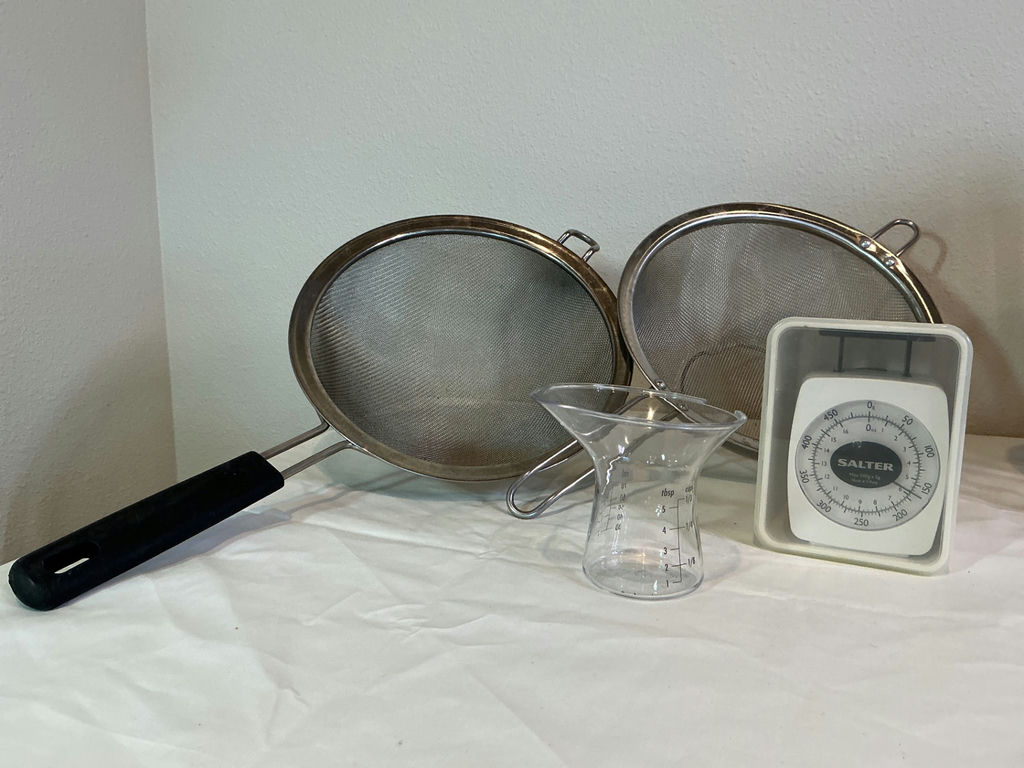 NutriBullet blender with cups and lids, mesh strainers, measuring beaker, and kitchen scale - image 3 of 3