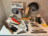 Assorted kitchen utensils, bakeware, and waffle maker.  - thumbnail 1 of 5