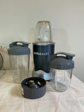 NutriBullet blender with cups and lids, mesh strainers, measuring beaker, and kitchen scale - thumbnail 2 of 3