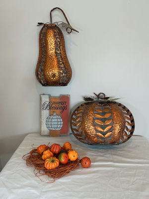 Copper metal pumpkins and autumn harvest decor. - Image 1 of 5
