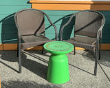 Two brown woven outdoor chairs with a green round metal side table - thumbnail 1 of 4